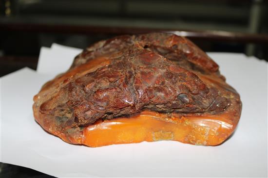 A large piece of raw amber, gross weight 1084 grams, approx. 7in by 7in by 3in.